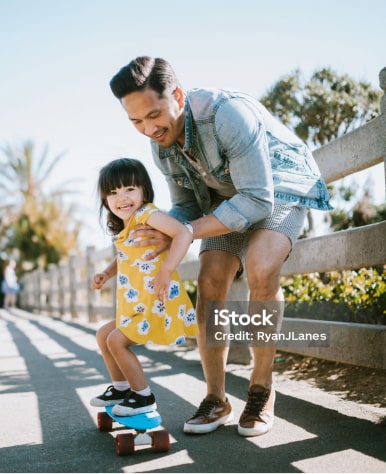 Dad with son riding bicycle